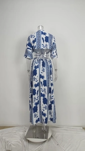 Detail of blue and white printed two-piece set with flare sleeves and A-line maxi skirt