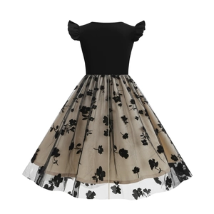 Detail of girls' dress featuring black flutter sleeves and floral embroidered mesh skirt