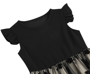 Close-up of girls black dress featuring ruffled sleeves and flocked butterfly mesh skirt