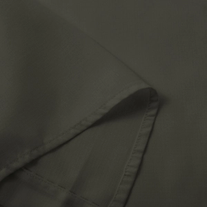 Close-up of dark grey woven fabric showing refined stitching and textile texture detail