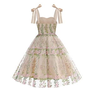 Detailed close-up of pink floral embroidery and tulle texture on strapless party dress
