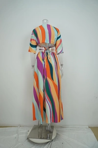 Detail of multi-color wavy striped crop top with back tie-up design and long skirt