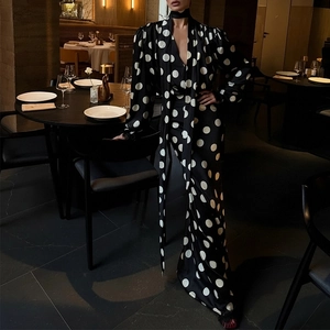 Elegant black polka dot maxi dress with V-neck and puff sleeves for women