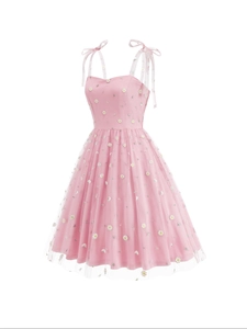 Pink tulle dress with daisy embroidery and adjustable bow straps in a sweet A-line style