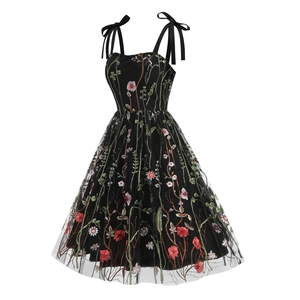 Elegant black tulle dress with colorful floral embroidery and ribbon shoulder bows