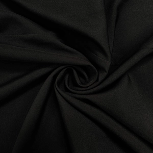 Close-up macro of black textile fabric showing elegant silk-like texture and spiral folds