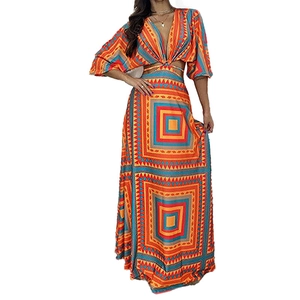 Bohemian geometric print maxi dress with deep V-neck and waist cut-outs in vibrant colors