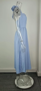 Detailed side view of an elegant light blue halter neck backless maxi dress on a mannequin