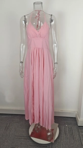 Detail of pink spaghetti strap maxi dress showing the pleated high waist and v-neck design