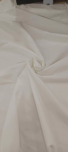 Close-up of elegant white fabric texture for spring halter backless dress detail