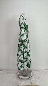 Detail of green and white marble print maxi dress with pleated tiers and drawstring waist