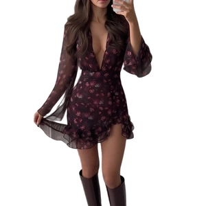 Floral V-neck mini dress with long sleeves and ruffled hem paired with tall boots