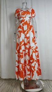 Detail of tiered floral maxi dress showing hollow waist and bubble sleeve design