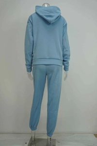 Rear view of a light blue hooded sweatshirt and jogger pants set with elastic cuffs