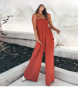 Fashionable rust red wide-leg jumpsuit with high waist pleated design and side pockets