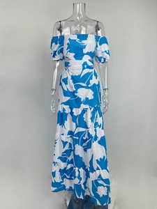 Detail of off-shoulder floral dress with waist cut-outs and ruffled layered skirt