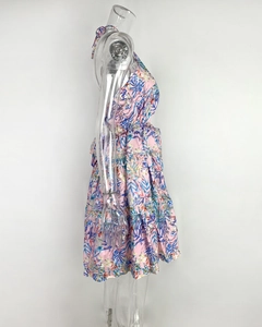 Detailed side view of pink floral halter dress with tiered ruffle skirt and leaf pattern