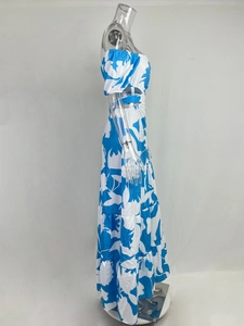 Close-up of tiered ruffled hem and vibrant blue floral print on summer maxi dress
