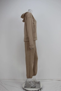Detail of khaki tracksuit with drawstring hoodie and elastic cuff jogger pants on mannequin