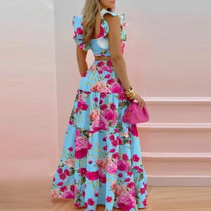 Detail view of floral two-piece set with cropped top and tiered maxi skirt in light blue
