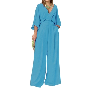 Light blue V-neck wide leg jumpsuit with kimono sleeves and pleated waist detail
