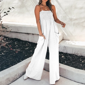 Elegant white wide-leg jumpsuit with pleated bodice, thin straps, and side pockets