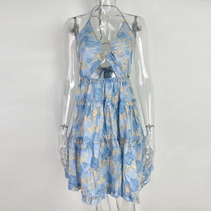 Close-up of floral halter neck dress with metal ring detail and waist cutout design