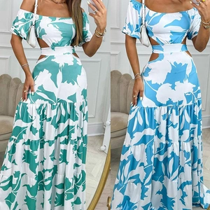 Detail of tiered floral maxi dress showing off-shoulder cut and waist cut-outs
