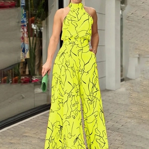 Tuta smanicata con scollo all'americana giallo fluo con stampa viso nero e gamba larga