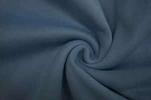 Macro shot of Morandi blue knitted fabric showing detailed texture and elastic fiber