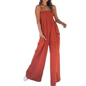 Women's smocked high-waisted wide-leg jumpsuit with spaghetti straps and pockets