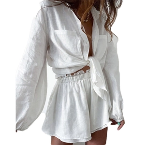 Women's white linen two-piece set featuring long sleeve button shirt and high waist shorts