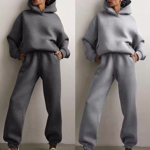 Women's oversized hooded tracksuit set in solid grey colors with drawstring detail