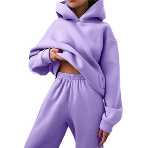 Women's two-piece lavender tracksuit set with hooded sweatshirt and high-waisted joggers