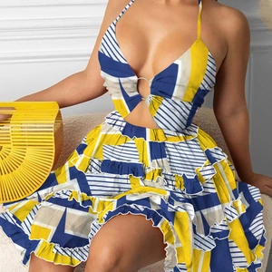 Detail of floral geometric print dress featuring V-neck cutout and ruffled hem layers
