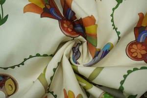 Close-up of colorful floral print fabric with vibrant orange and blue flower patterns