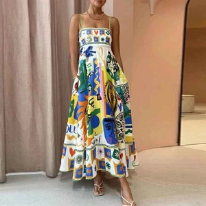 Detailed view of colorful graffiti prints and soleil artwork on a white sundress