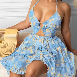 Detail of light blue floral halter dress featuring cutout chest and metal ring buckle