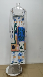 Detail view of the back of a floral graffiti print maxi dress with elastic smocking
