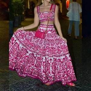 Women's two-piece fashion set with fuchsia majolica floral crop top and maxi skirt