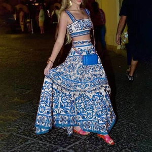 Women's two-piece set featuring square neck crop top and maxi skirt in blue majolica print