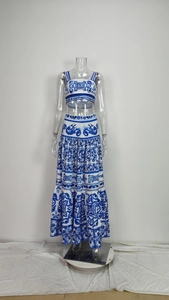 Detailed view of the blue and white floral print on a two-piece crop top and maxi skirt set