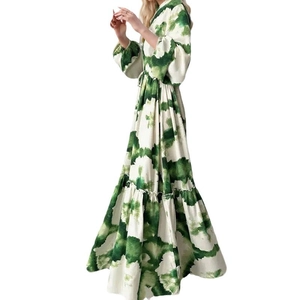 Detail of long sleeve floral dress with green tie-dye print and ruffled hemline