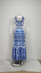 Detail view of the back side of blue and white floral crop top and tiered maxi skirt set