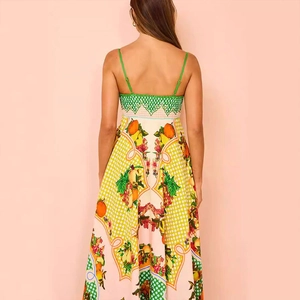 Detail of the green geometric lace back design on a citrus print maxi dress