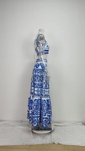 Detail of two-piece floral set featuring a crop top and high-waisted tiered maxi skirt