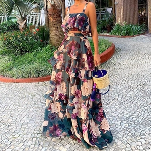 Women's two-piece floral print crop top and high-waist tiered maxi skirt vacation set