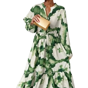 Women's V-neck maxi dress with artistic green and white print and ruffled hemline
