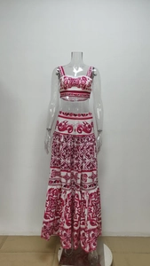Detailed close-up of two-piece floral set with crop top and high-waisted maxi skirt