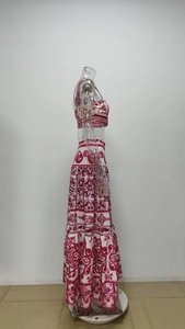 Detail of red Baroque tile print on white crop top and layered maxi skirt set